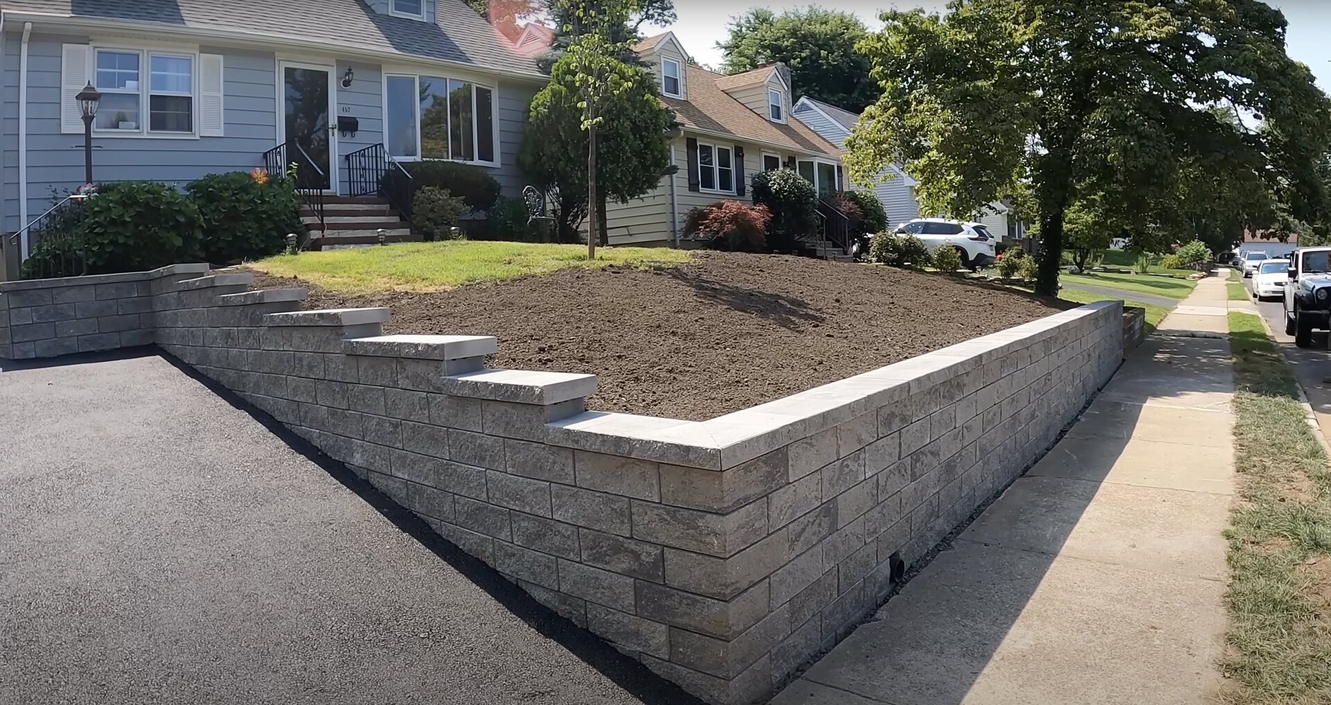 Professional concrete block retaining wall construction Concrete block retaining wall construction for residential landscaping and drainage